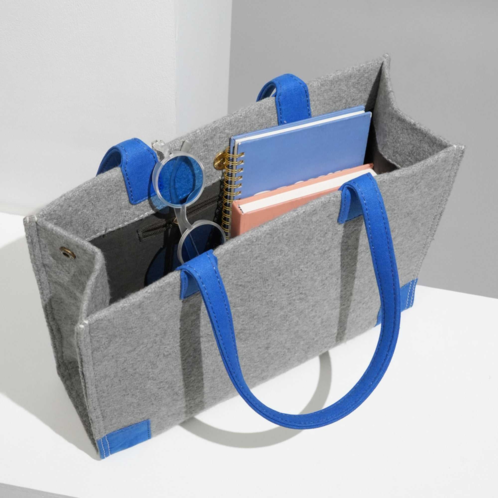 Grey Felt Handbag with Vibrant Blue Handles for Modern Style